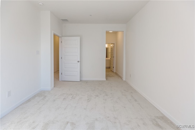 unfurnished bedroom with light carpet