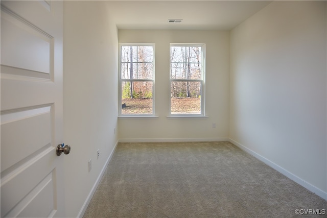 empty room featuring light carpet