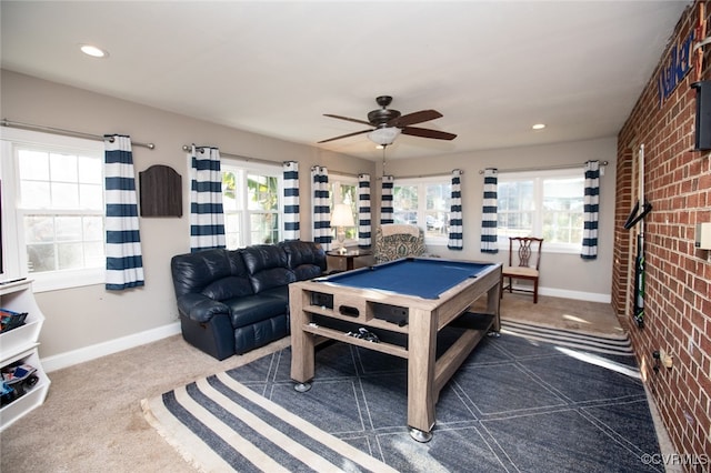 playroom featuring ceiling fan, dark carpet, billiards, and brick wall