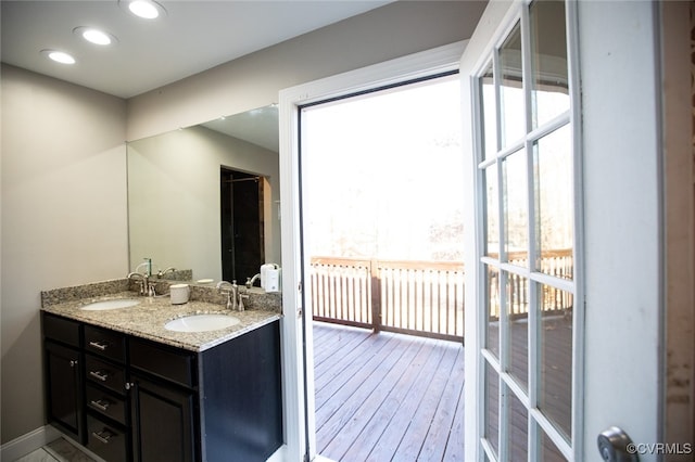 bathroom featuring radiator, hardwood / wood-style floors, and vanity