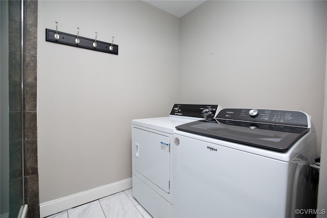 laundry area with separate washer and dryer