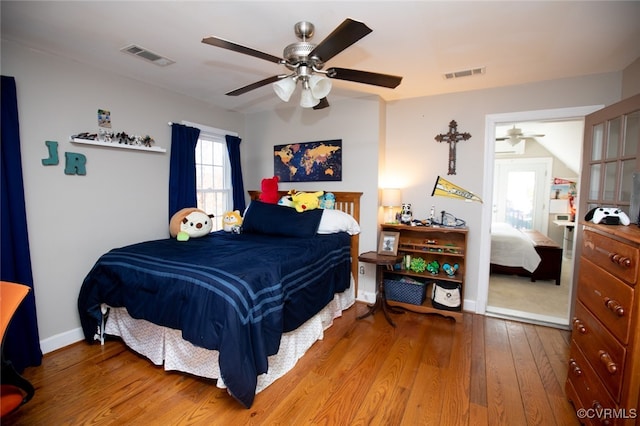 bedroom with hardwood / wood-style flooring and ceiling fan