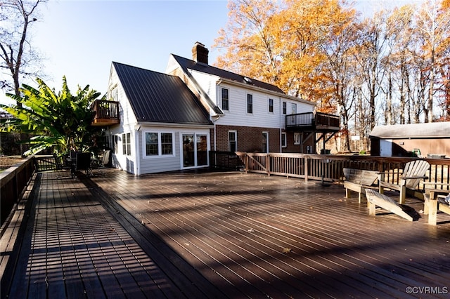 wooden terrace featuring a shed