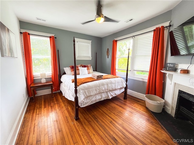 bedroom featuring hardwood / wood-style floors and ceiling fan