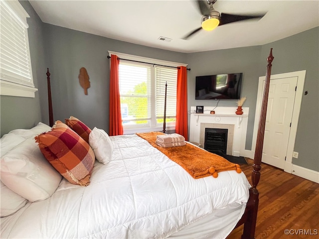 bedroom featuring hardwood / wood-style floors and ceiling fan