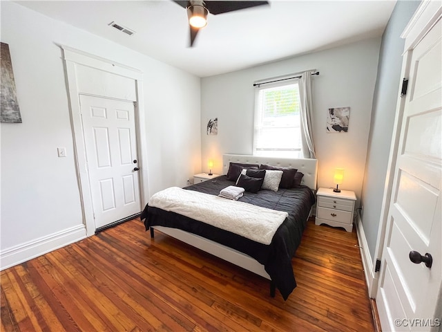 bedroom featuring ceiling fan and dark hardwood / wood-style flooring