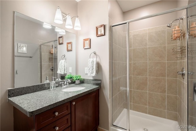 bathroom featuring a stall shower and vanity