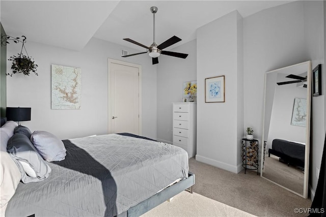 bedroom featuring carpet, baseboards, and a ceiling fan