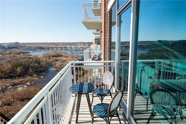 balcony featuring a water view