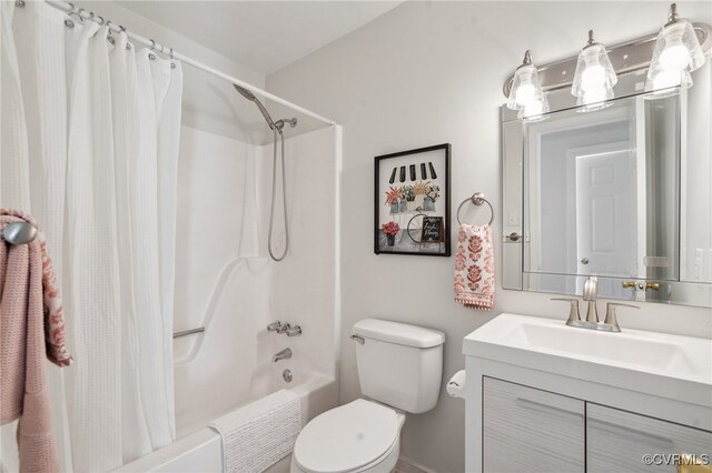 full bathroom with vanity, shower / bath combination with curtain, and toilet