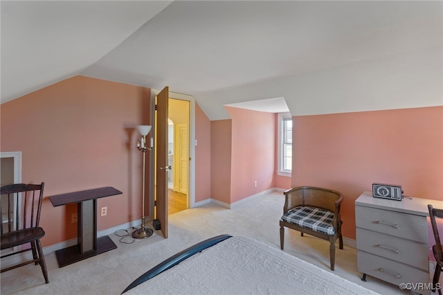 carpeted bedroom with lofted ceiling