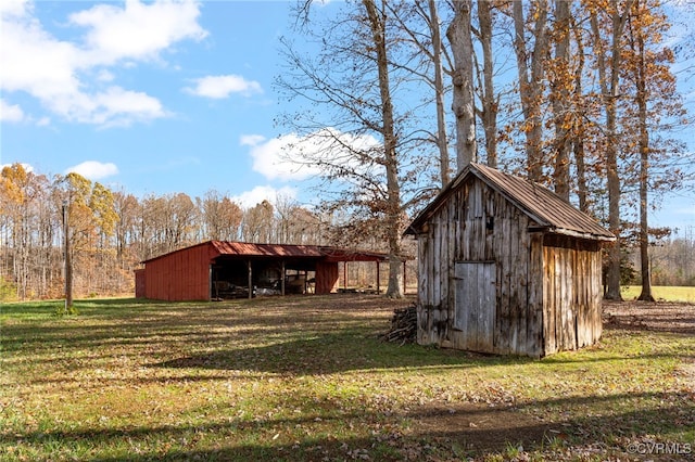 view of outbuilding featuring a yard