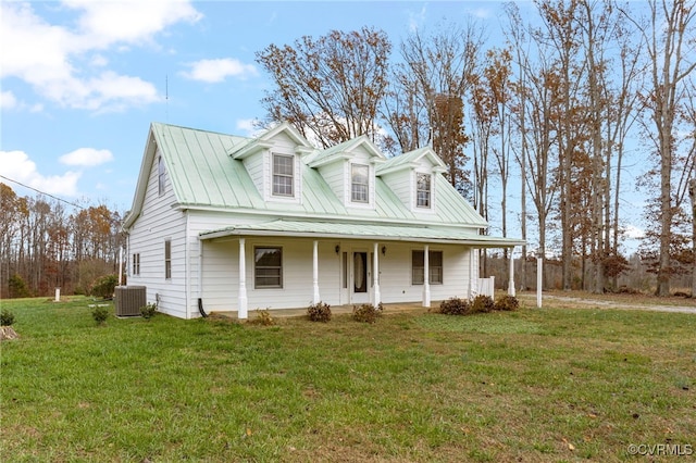 cape cod home with a front lawn and cooling unit