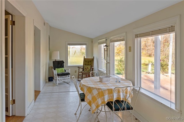 sunroom with vaulted ceiling and plenty of natural light