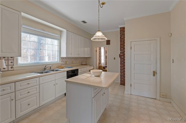 kitchen with pendant lighting, a center island, white cabinetry, and sink