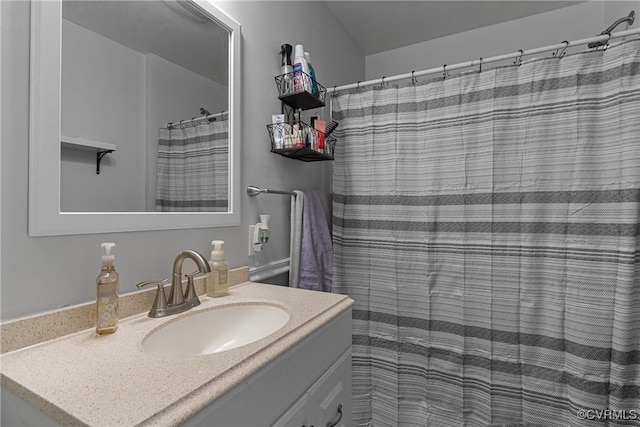 bathroom with vanity and curtained shower