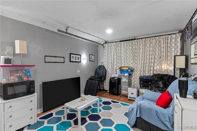 bedroom with hardwood / wood-style floors