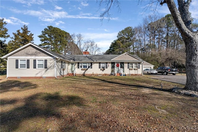 ranch-style house with a front lawn