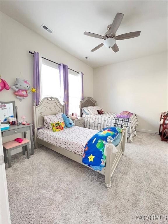 bedroom with ceiling fan and carpet