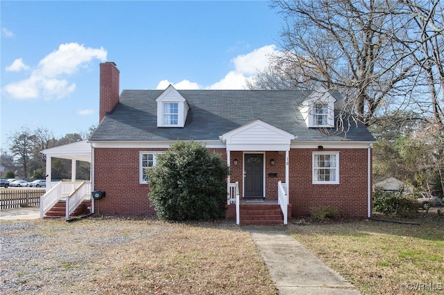 new england style home with a front yard