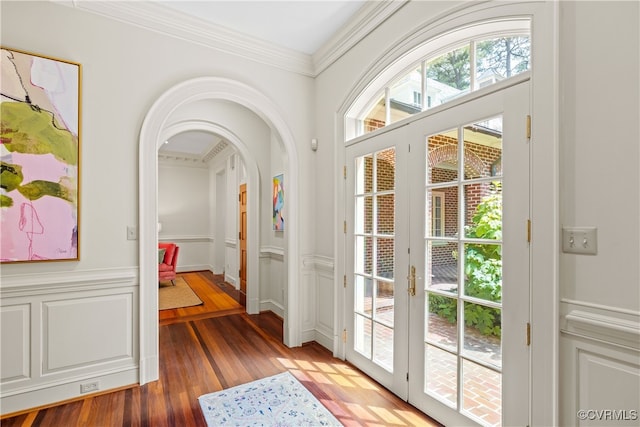 doorway to outside featuring crown molding, french doors, and hardwood / wood-style flooring