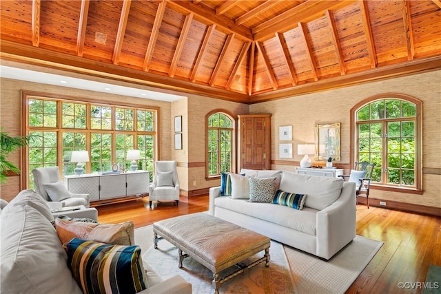 living room with high vaulted ceiling, light hardwood / wood-style flooring, a wealth of natural light, and wood ceiling