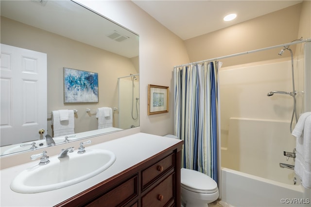 full bathroom with vanity, toilet, and shower / tub combo with curtain