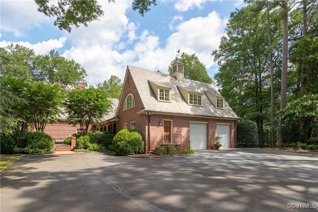 view of side of home with a garage