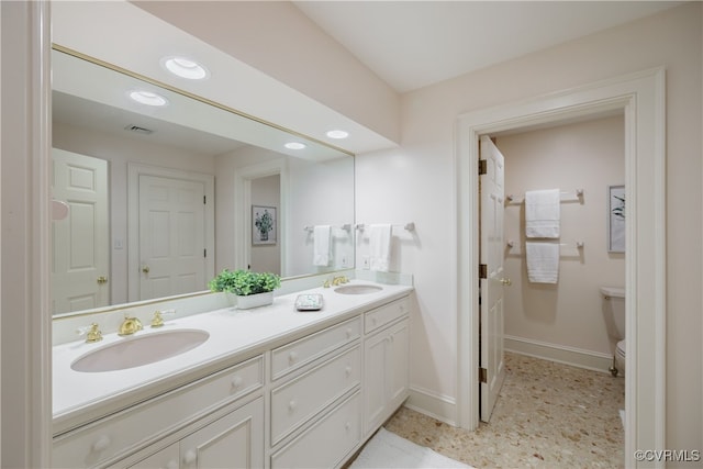 bathroom with vanity and toilet