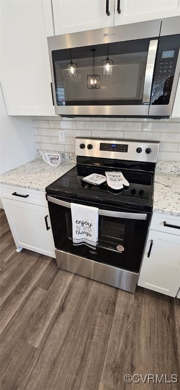 kitchen featuring white cabinetry, dark hardwood / wood-style flooring, and stainless steel appliances