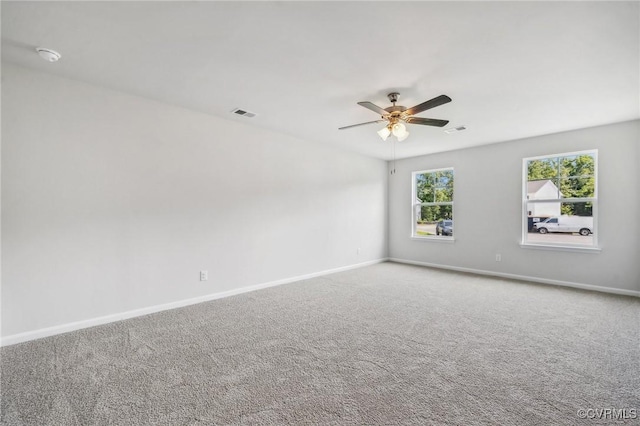 spare room featuring carpet flooring and ceiling fan