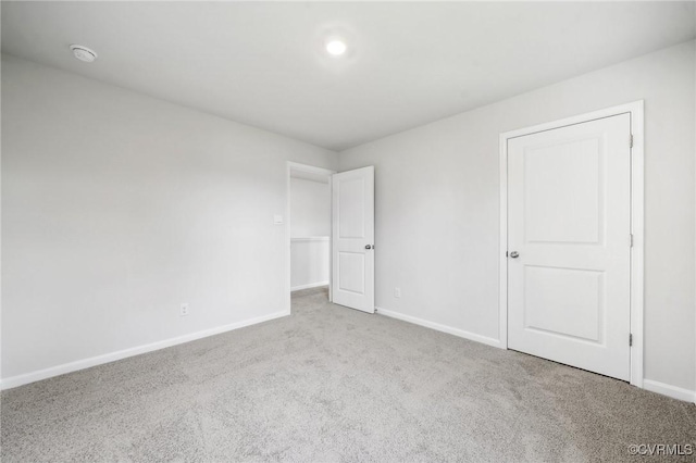 spare room with light colored carpet