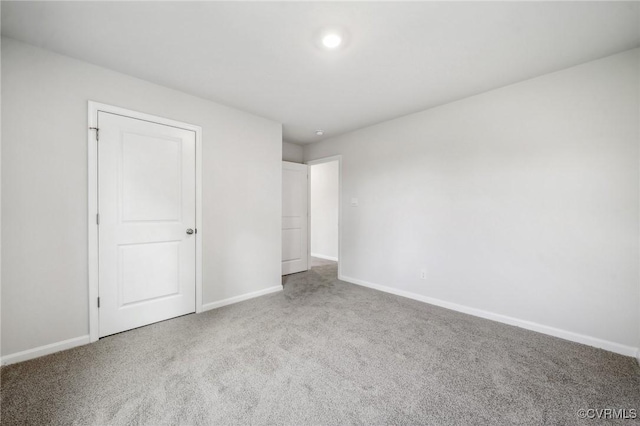 unfurnished bedroom with carpet flooring