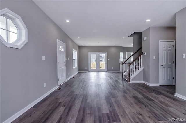 entrance foyer featuring dark wood-type flooring and french doors