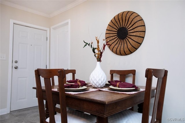 dining area with crown molding