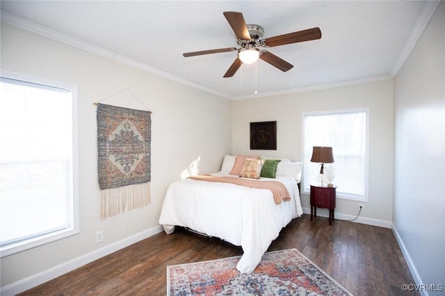 bedroom featuring ceiling fan, dark hardwood / wood-style flooring, and crown molding