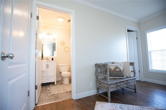 living area featuring dark hardwood / wood-style flooring and ornamental molding