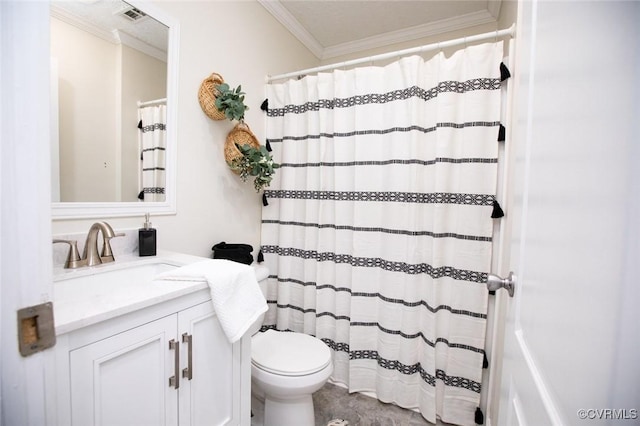 bathroom with toilet, vanity, and ornamental molding