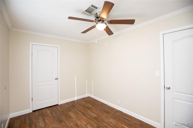 unfurnished room featuring crown molding, dark hardwood / wood-style flooring, ceiling fan, and a textured ceiling