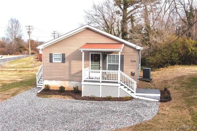 bungalow with central AC and a front lawn