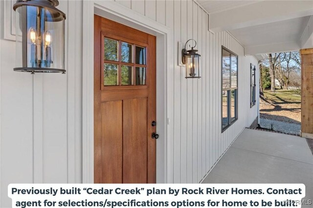 property entrance with covered porch