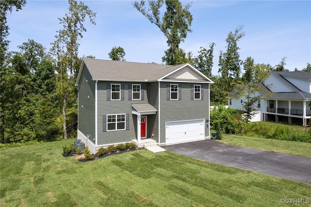 view of front of house featuring central AC, a garage, and a front lawn