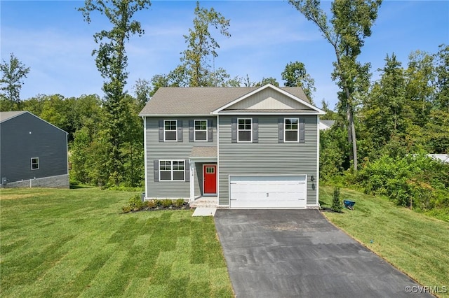 view of front of property with a garage and a front lawn