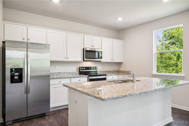 kitchen with white cabinets, sink, and stainless steel appliances