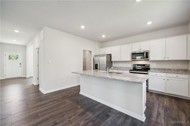 kitchen featuring white cabinetry, a kitchen island with sink, and appliances with stainless steel finishes