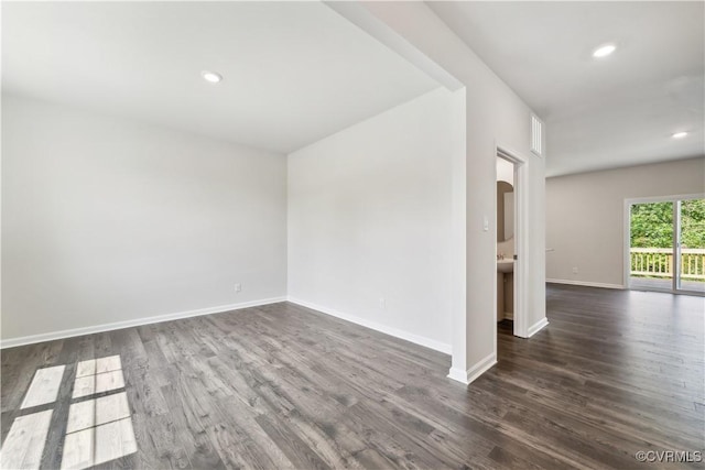 unfurnished room with dark hardwood / wood-style floors