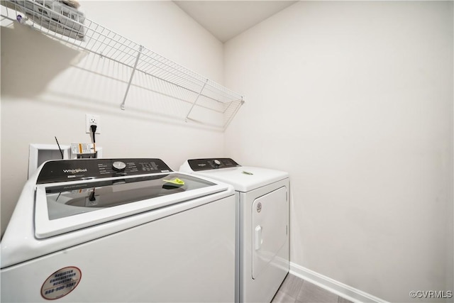 washroom with independent washer and dryer