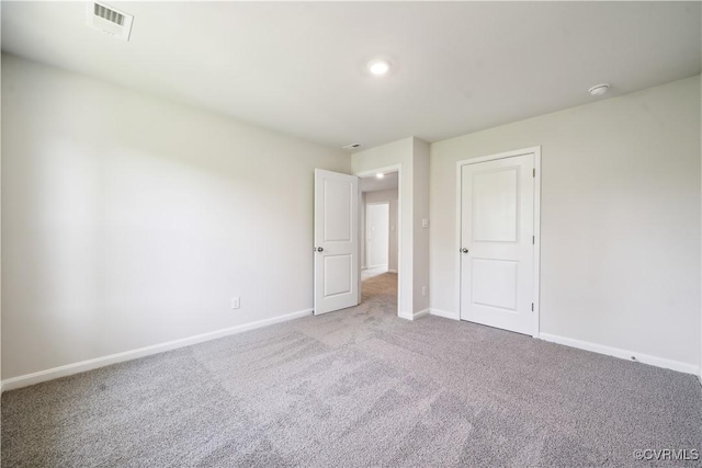 unfurnished bedroom with light carpet