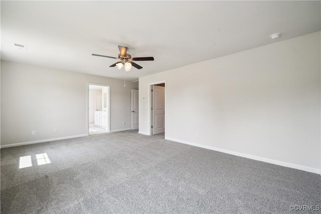 spare room featuring carpet flooring and ceiling fan