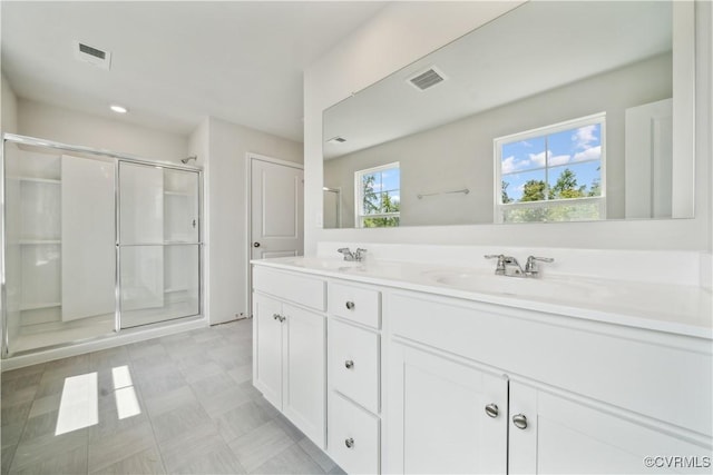 bathroom featuring vanity and walk in shower